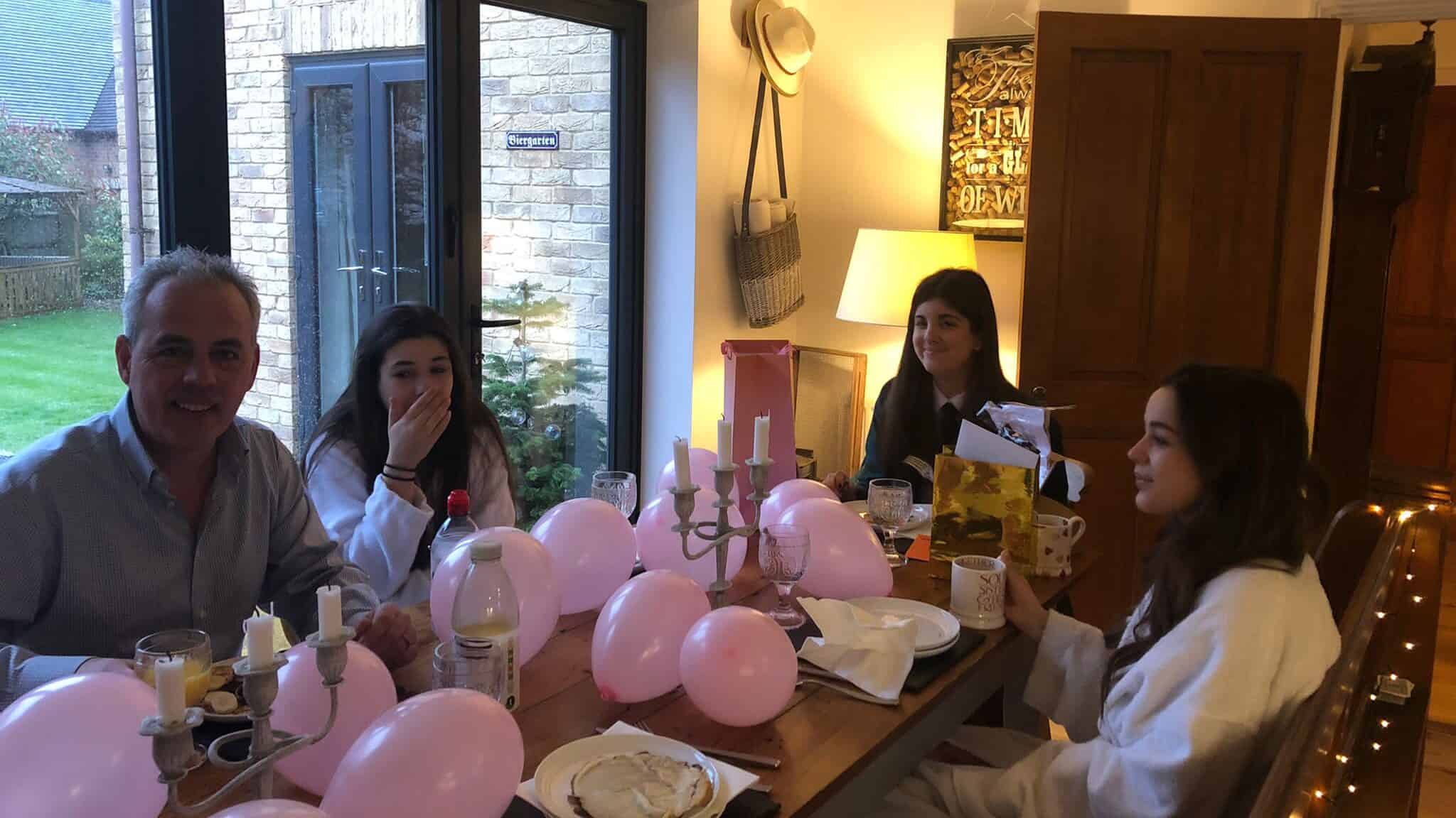 Clean modern student accommodation students sat at the table with their host family