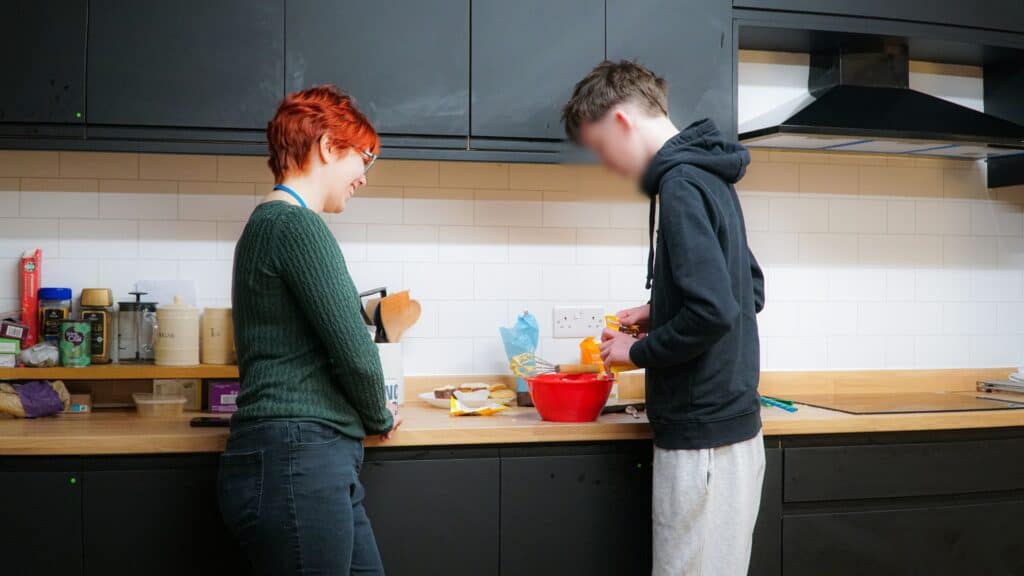 A student baking in our centre kitchen at UKG Language & Learning in Ringwood