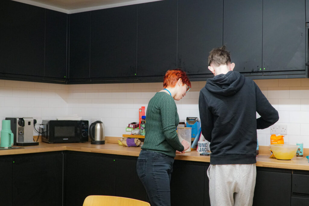 A student learning Baking Skills in our kitchen in the learning centre.